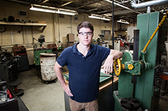 Undergrad Evan Wilson in the machine shop